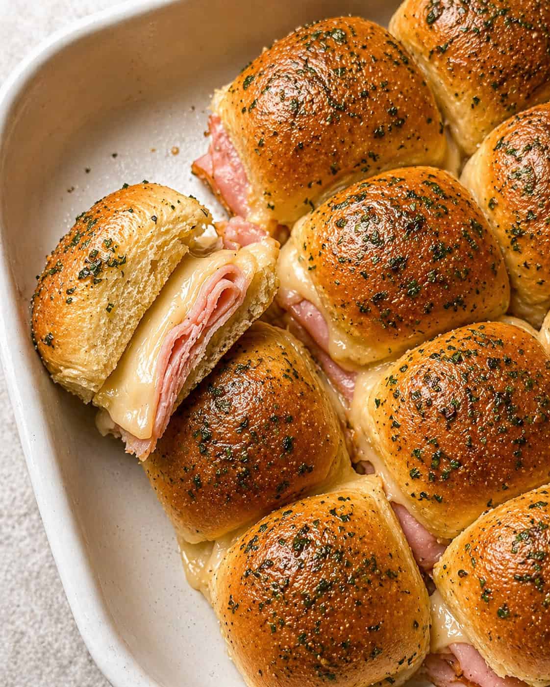 ham and swiss sliders recipe - buttery dinner rolls filled with ham and swiss cheese.