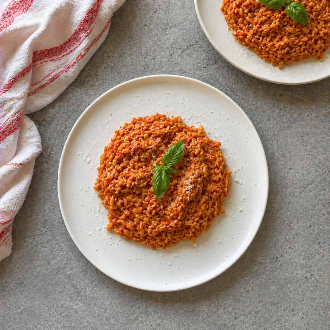 Tomato Orzo served on a white serving dish.