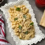 Pasta with chicken and basil.